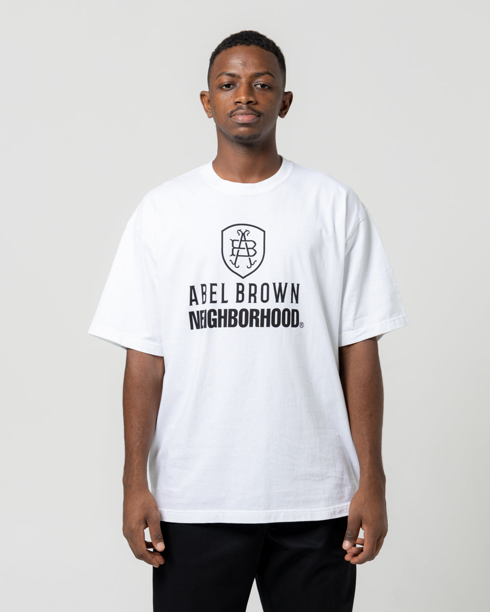 NH. x Abel Brown. SS-1 Tee | White